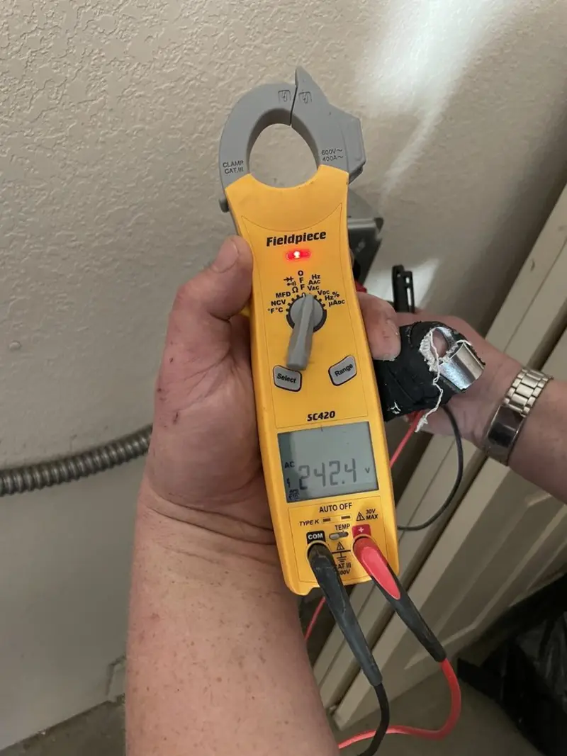 Voltage testing with clamp meter during Outlet Installation in Mesquite